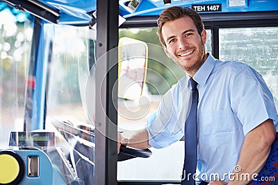 Portrait Of Bus Driver Behind Wheel Stock Photo