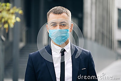 Portrait Business Man in Protective Face Mask Look at Camera COVID-19 Coronavirus Infection. Face mask Covid-19 Stock Photo