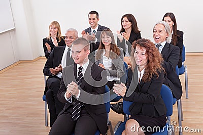 Portrait Of A Business Men And Women In Seminar Stock Photo