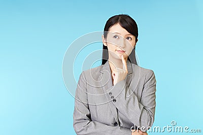Uneasy Asian business woman Stock Photo