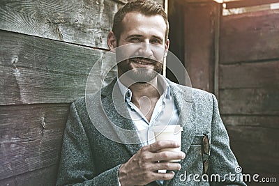 portrait of businessman having break holding coffee Stock Photo
