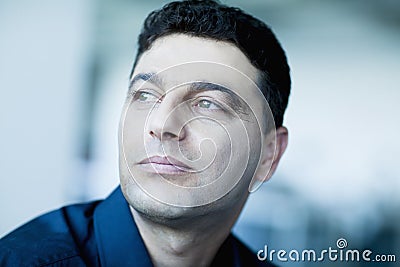 Portrait of businessman looking away in contemplation Stock Photo