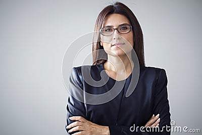Portrait of businesswoman on grey background Stock Photo