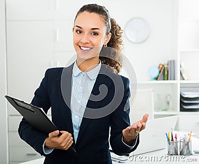 Portrait businesswoman holding documents in hands Stock Photo