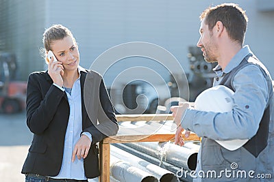 Portrait businesswoman reviewing construction outdoors Stock Photo
