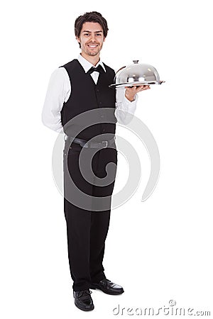 Portrait of a butler with bow tie and tray Stock Photo