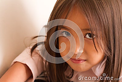Portrait of calm, serious and confident little girl looking Stock Photo