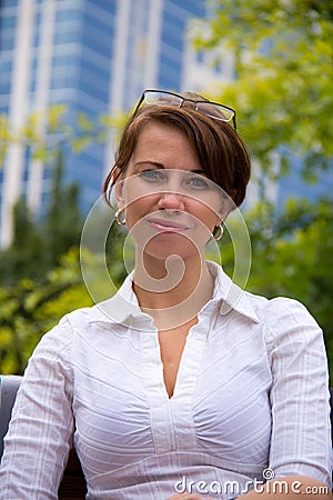 Portrait of a casual business woman in the park Stock Photo