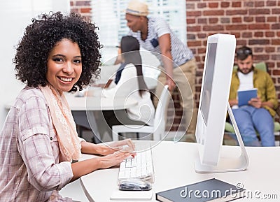Portrait of casual young woman using computer Stock Photo