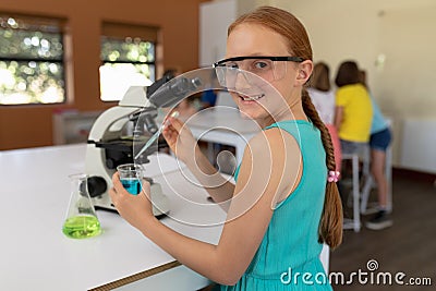 Elementary school girl in chemistry class Stock Photo