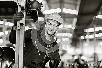 Portrait of Caucasian factory worker handsome smart with safety clothes. Industrial art black and white photography Stock Photo