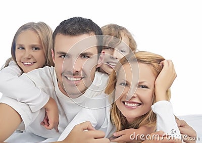 Portrait of caucasian family members in group laying on sofa Stock Photo