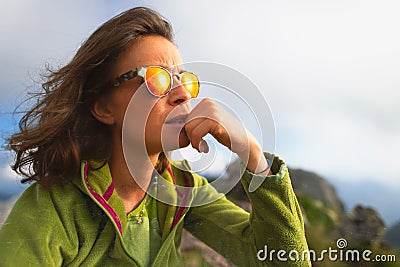 Portrait of caucasian girl resting during an alpine trekking Stock Photo