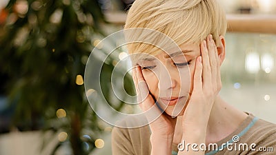 Portrait caucasian middle-aged adult 40s woman tired lady exhausted stressed female holding head from bad problem Stock Photo