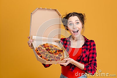 Portrait of charming amusing young woman holding pizza Stock Photo