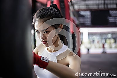 Portrait charming beautiful boxer woman: Attractive girl is practicing boxing. Gorgeous girl is punching target. Pretty girl love Stock Photo