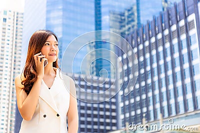 Portrait charming beautiful young businesswoman. Attractive business woman call customer for telling good news. Pretty girl looks Stock Photo