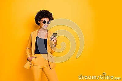 Portrait of charming cool afro american lady use her smartphone communicate with followers in blog type posts comments Stock Photo