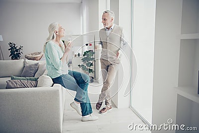 Portrait of charming people grandmother grandfather wear lifestyle denim jeans trousers teal brown pullovers sitting Stock Photo