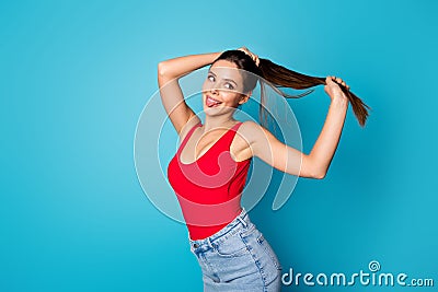 Portrait of cheerful sweet cute pretty youth girl hold hand ponytails enjoy spring anti dander silky haircare effect Stock Photo