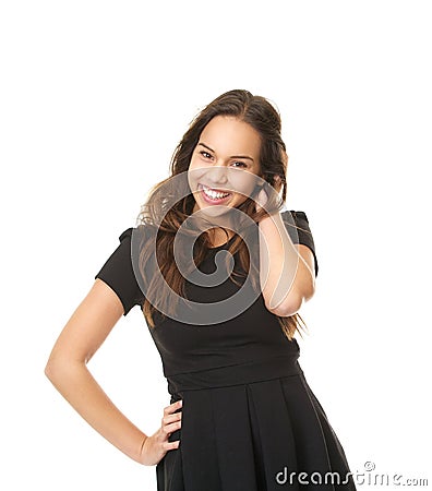 Portrait of a cheerful young lady laughing with hand in hair Stock Photo