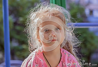 Child beautiful girl 4 years old with curly hair and huge brown eyes Stock Photo