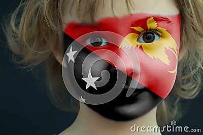 Portrait of a child with a painted flag of Papua New Guinea Stock Photo