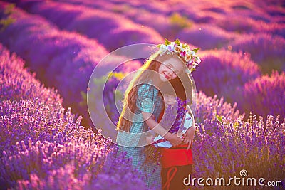 Portrait of children boy and girl in traditional Bulgarian folklore costume in lavender field during sunset Stock Photo