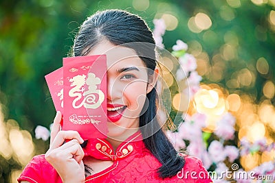 Portrait chinese woman red dress traditional cheongsam in chines Stock Photo