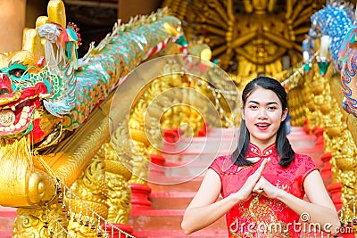 Portrait chinese woman red dress traditional cheongsam in chines Stock Photo