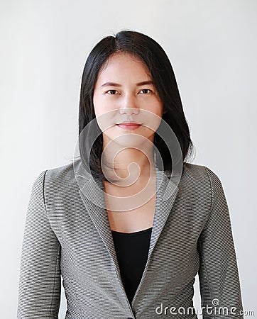 Portrait close-up of young Asian businesswoman over white background Stock Photo