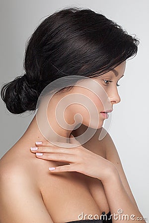 Portrait closeup of a young sensual attractive model woman looking down. Stock Photo