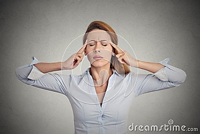 Portrait concentrating woman grey wall background. Stock Photo