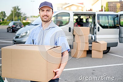 Portrait of confidence express courier and delivery van Stock Photo