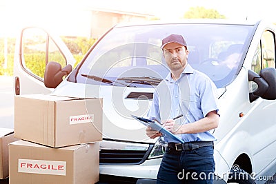 Portrait of confidence express courier and delivery van Stock Photo