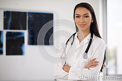 Portrait, confident doctor and woman in hospital for healthcare, wellness or xray in Brazil. Face, medical professional Stock Photo