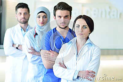 Portrait of confident happy group of doctors standing at the medical office Stock Photo