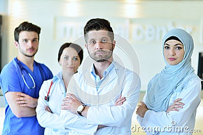 Portrait of confident happy group of doctors standing at the medical office Stock Photo