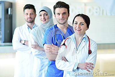 Portrait of confident happy group of doctors standing at the medical office Stock Photo