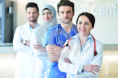 Portrait of confident happy group of doctors standing at the medical office Stock Photo