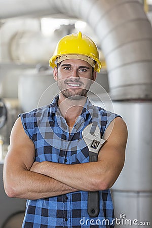 Portrait of confident industrial worker standing arms crossed Stock Photo
