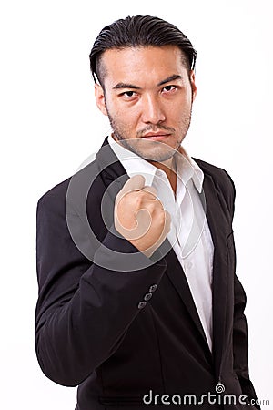 Portrait of confident, successful businessman holding his collar Stock Photo