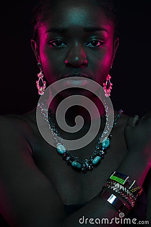 Sensuous Woman Wearing Jewelry Over Black Background Stock Photo