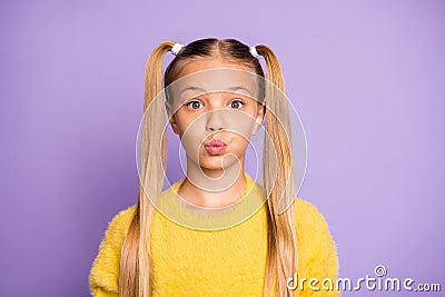 Portrait of confused funky kid made mistake have her lips pouted plump say oops feel frustrated anxious wear yellow Stock Photo