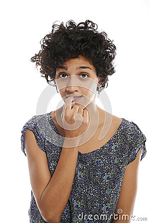 Portrait of confused and uncertain hispanic girl Stock Photo