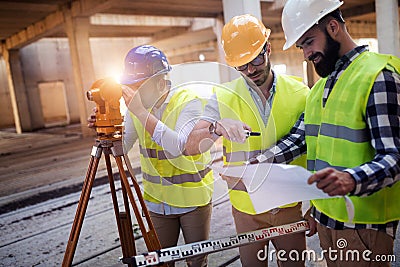 Portrait of construction engineers working on building site Stock Photo