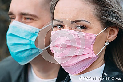 Portrait of a Couple of European appearance with medical masks. Stock Photo