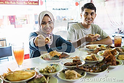 Portrait of the couple young eating dish Stock Photo