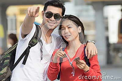 portrait couples of asian younger man and woman backpacker traveling to destination location Stock Photo