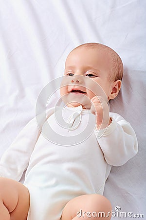 Portrait of a crawling baby on the bed in the bed.Baby,child,newborn. Stock Photo